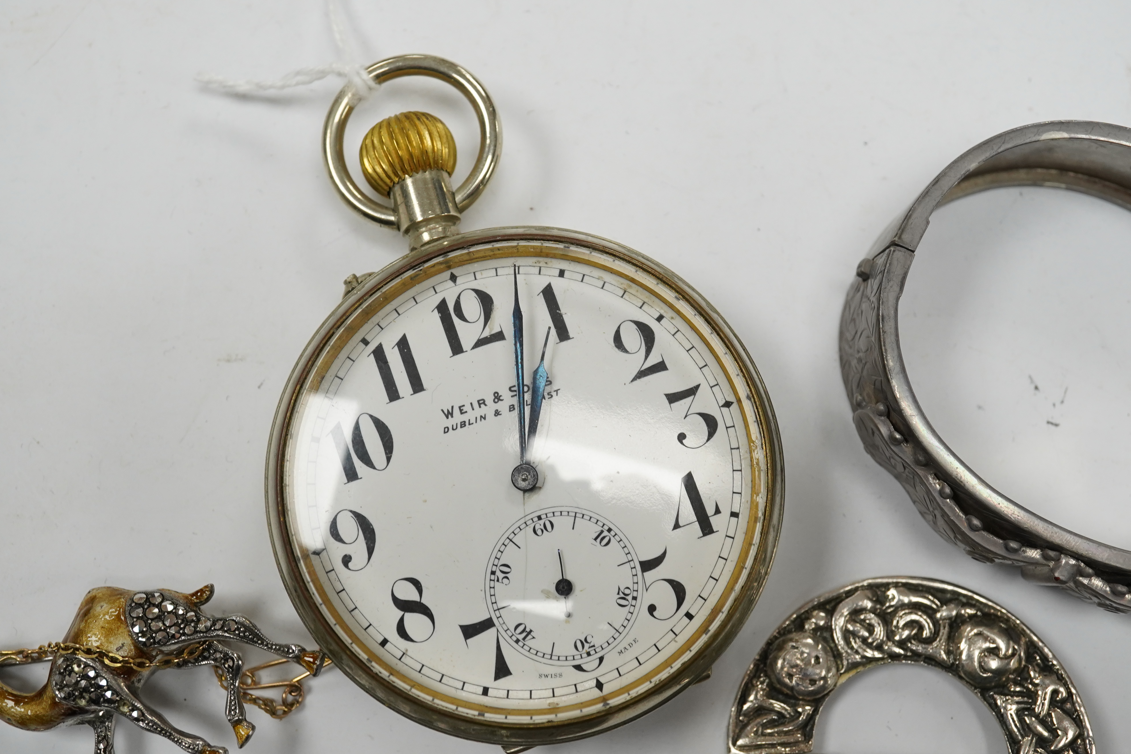 Assorted jewellery etc. including a silver bangle, a white metal Celtic style brooch and a Weir & Son nickel cased pocket watch. Condition - poor to fair to good.